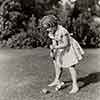 Shirley Temple at home playing croquet, 1938