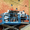 Shepard Fairey and crew painting a mural in South Park neighborhood of San Diego, July 15, 2010