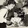 Shirley Temple at home with daughter Lori and son Charles and a 1957 vinyl Shirley Temple doll, November 1957